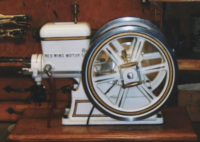 An elegantly striped hit-n-miss engine.