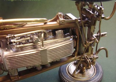 A bottom view of the front suspension and engine pan.