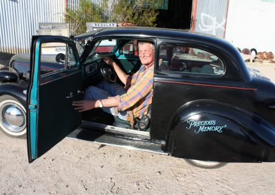 Ernie inside his Chevy Sedan.
