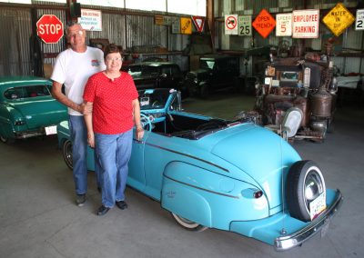 Ernie and Sheila posing with the convertible.