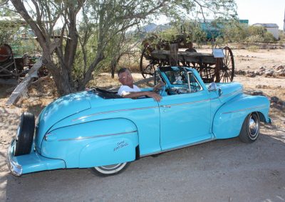 Ernie inside the '42 Deluxe Convertible