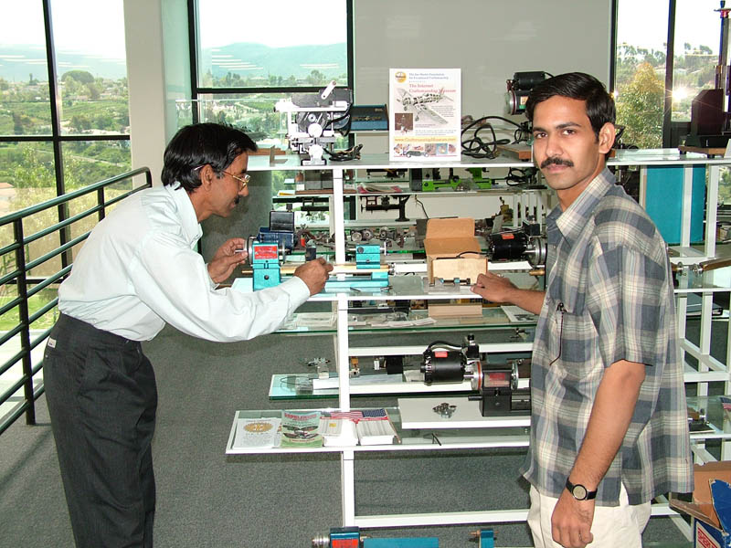 Iqbal and His Son Iqbal and his son visiting the Sherline factory.