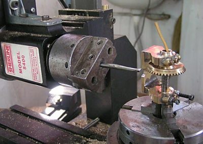 Horizontal mill boring holes in engine casting.