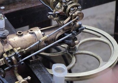 Engine and flywheel mounted on a test stand.