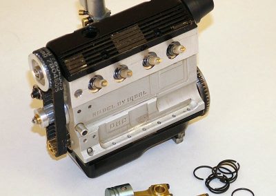 Alternate view of engine with piston, rods, and rings.
