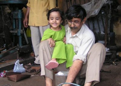 Iqbal and a child test riding the tank engine.