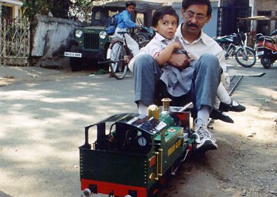 Iqbal and granddaughter riding the Indian Glory.