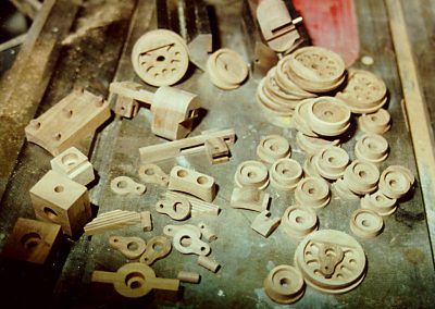 A selection of railroad wheels, springs and valve gear before assembly.