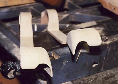 Wooden fenders for a model car.