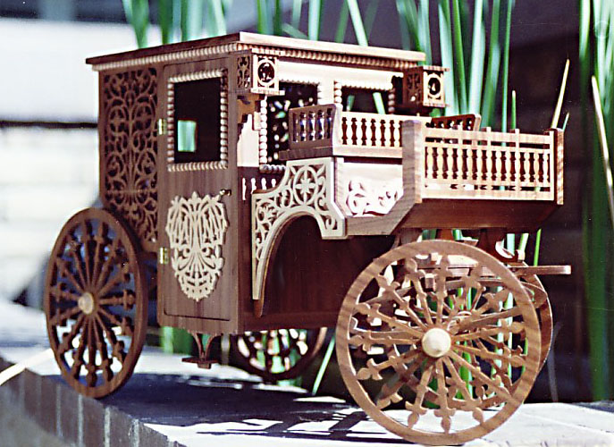 Wooden Carriage Model Another intricate wooden carriage model.