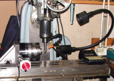 Side view of CNC indexing operation.