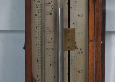 A barometer scale before refurbishment.