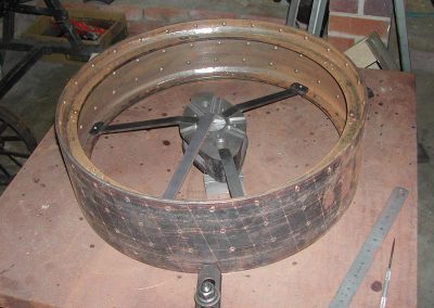 Fitting spokes to a wheel.