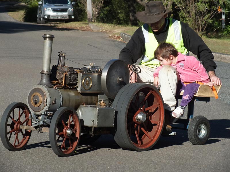 Ross Riding His Traction Engine Ross testing out the traction engine with a small copilot.