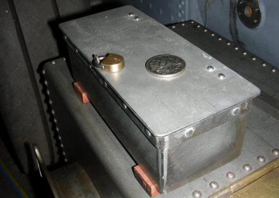Lock box with coin for reference.