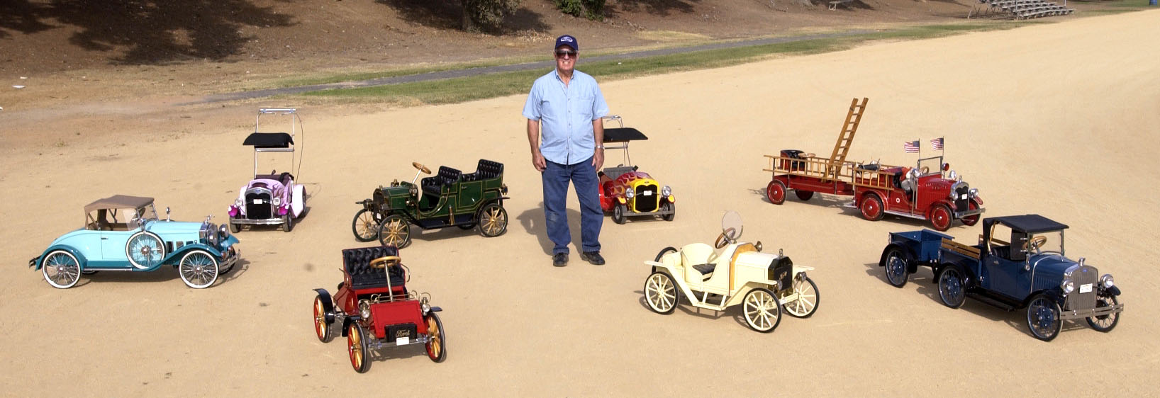 Bill Brown With His Pedal Cars Bill Brown with some of his pedal cars.