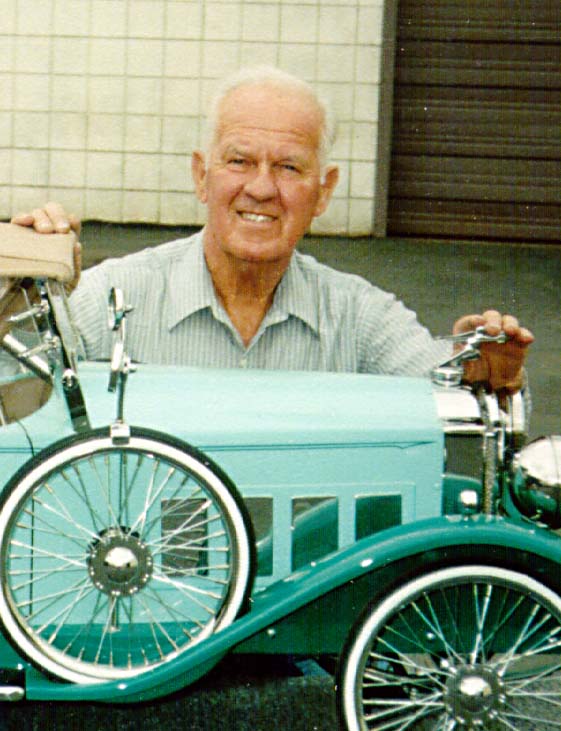 Bill With His Pedal Car Bill posing behind one of his pedal cars.