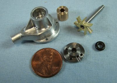 More components, with coins for scale reference.