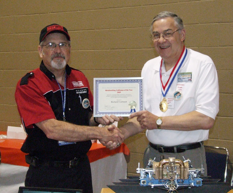 Richard Accepting His Award Craig Libuse (left) giving Richard his award for Craftsman of the Year.
