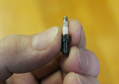 The miniature spark plug used for the Stinger engine.