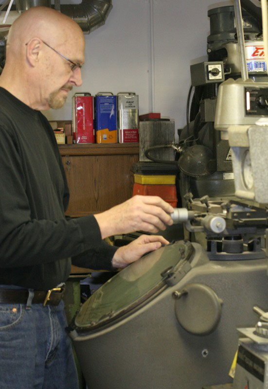 Conley64 Gary using the Optical Comparator.