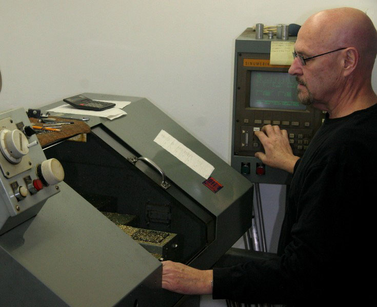 Conley68 Gary using the CNC lathe.