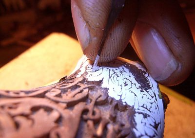 Close view of the carving process.