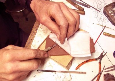 Peeling away the paper.