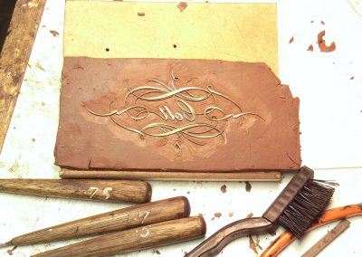 Scraping off the clay.