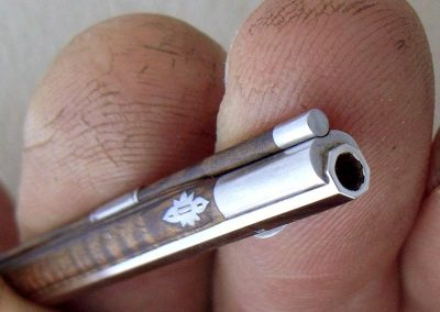 Close view of rifle barrel.