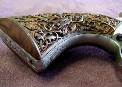 Engraving work on a Colt revolver.