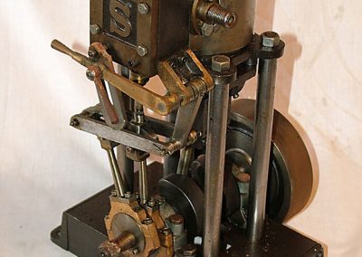 An elaborate vertical steam engine.