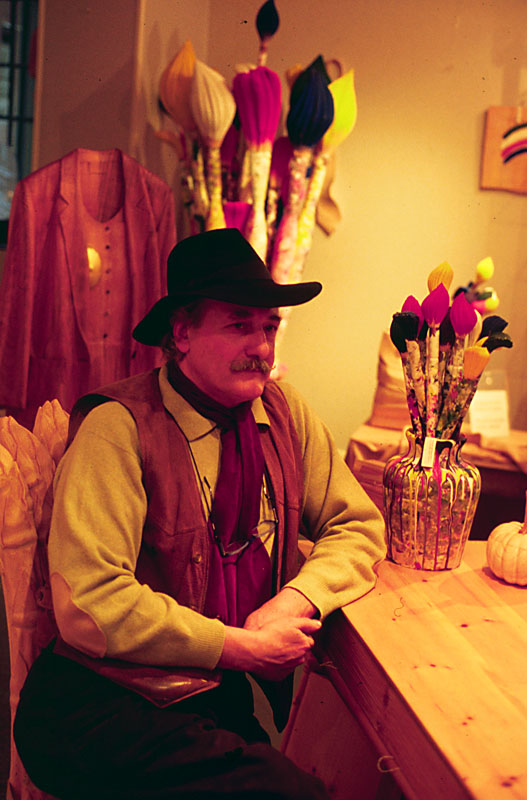De Marchi in His Shop De Marchi in his shop, with carved paint brushes behind him.