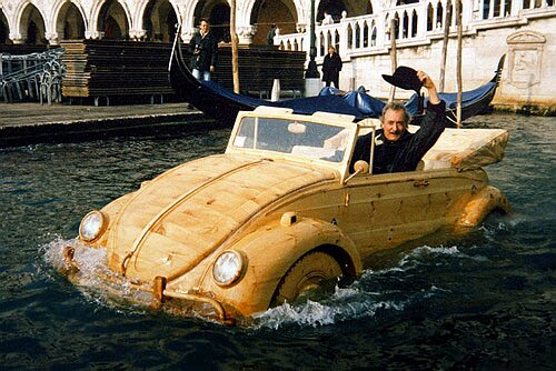 Mr. De Marchi in His Floating Wooden VW Bug. Mr. De Marchi in his floating wooden VW Bug.