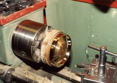 Turning a brass plate.
