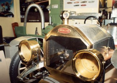 Headlamps and radiator attached to the frame.
