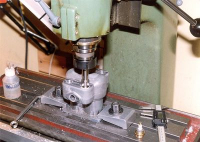 Boring holes in the cylinder casting on the mill.