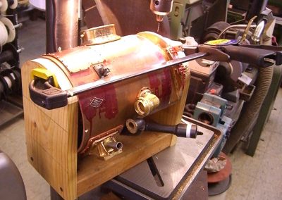 A jig holding the smoke box for machining.
