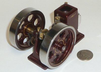 Another view of the hit-n-miss engine with coin for reference.