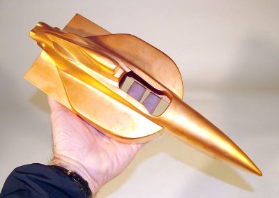 An unpolished copper body of an IndyCar