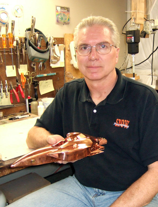 Michael Dunlap With One of His Scale Model Cars Mike Dunlap holding the body of one of his 1/12 scale cars.