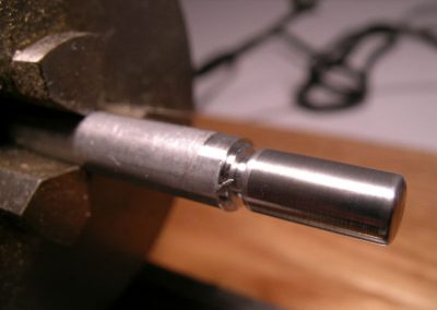 A fuel tank being turned on the lathe.