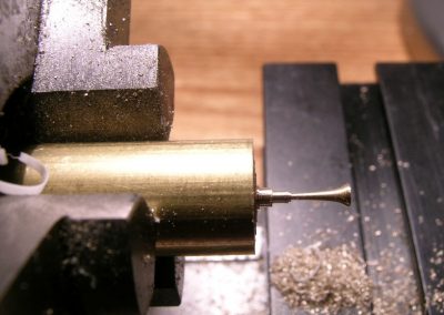 An air horn being turned on the lathe.