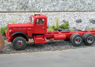 The Mack truck with a penny for scale.