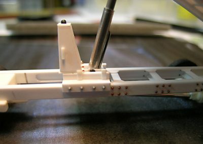 The scratch-built hydraulic dump mechanism for the dump truck.