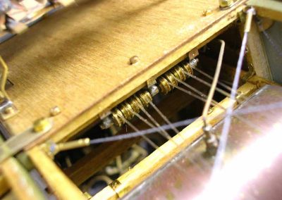 A view of the pulleys that work the cockpit controls.