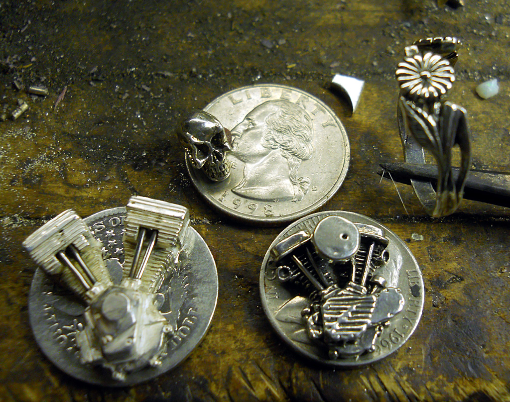 Harley Engine Pins and Skull Some of Bryan's tiny engines with a silver skull.