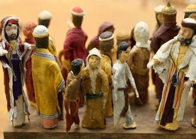 A group of tiny figures in the temple.