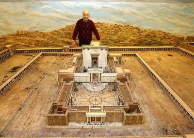 Mr. Garrard standing with his model temple.