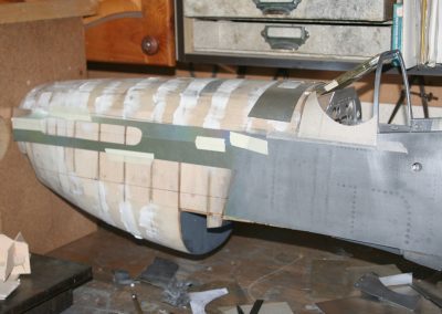 Work progresses on the exterior skin and rivet details.